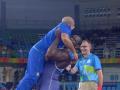 Cuba's Lopez celebrates gold with dance and body slams coach