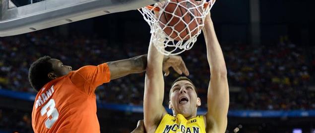 Mitch McGary of Michigan dunks against Syracuse at the 2013 NCAA Tournament Final Four.