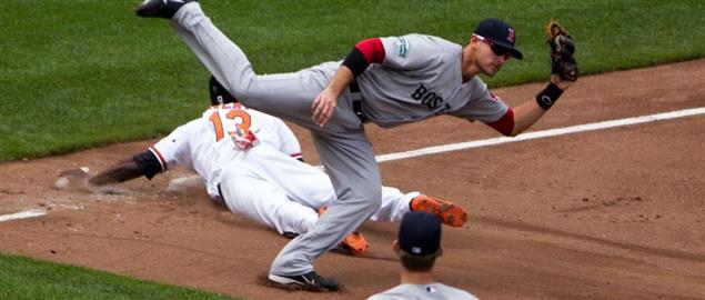 Red Sox's Middlebrook leaps over Orioles' Avery, tagging him for stolen base try. 05/23/12
