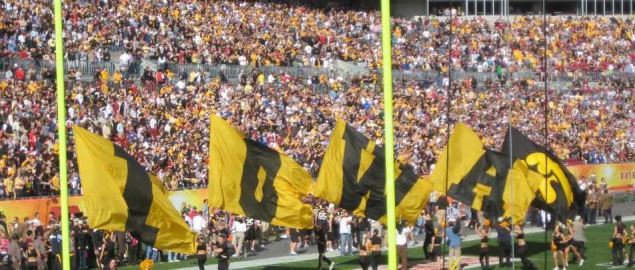  Iowa Football banners rushing the field at Outback Bowl